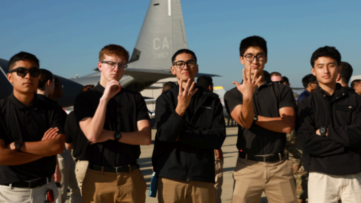 Cadets forming 045 with their hands.