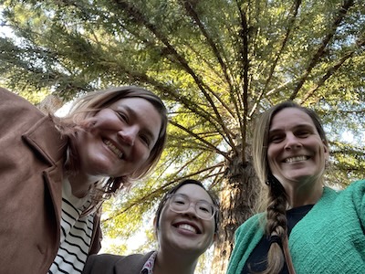 Photograph of Cassandra Paul, Gina Quan, and Brianne Gutmann in front of a Moon Tree.